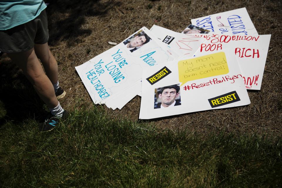 Signs lay on the ground during a protest against a scheduled visit by House Speaker Paul Ryan at a campaign event for Republican candidate for 6th congressional district Karen Handel in Dunwoody, Ga. on May 15, 2017. (Photo: David Goldman/AP)