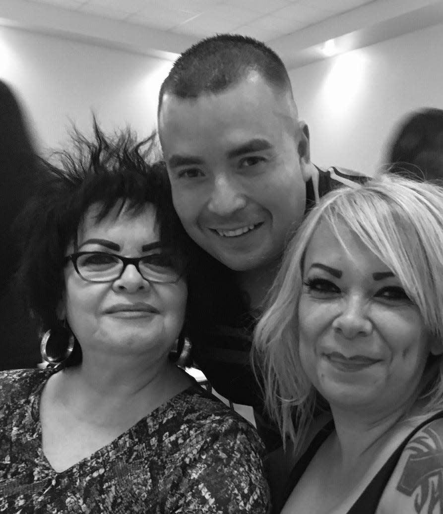 Deputy Peter Herrera with his mother, Esther Herrera, left, and his aunt, Paulina Hijar.