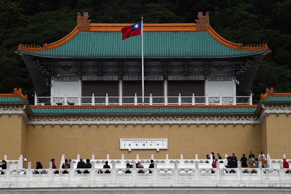 Tourists walk in front of Taiwan's National Palace Museum in Taipei on March 13, 2019. (Photo by Sam YEH / AFP)        (Photo credit should read SAM YEH/AFP/Getty Images)