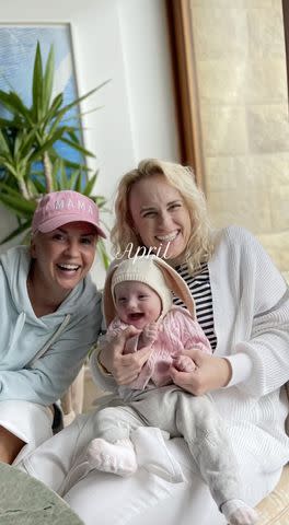 <p>Rebel Wilson/Instagram</p> Rebel Wilson and her fiancée Ramona Agruma pose with baby Royce on Easter.