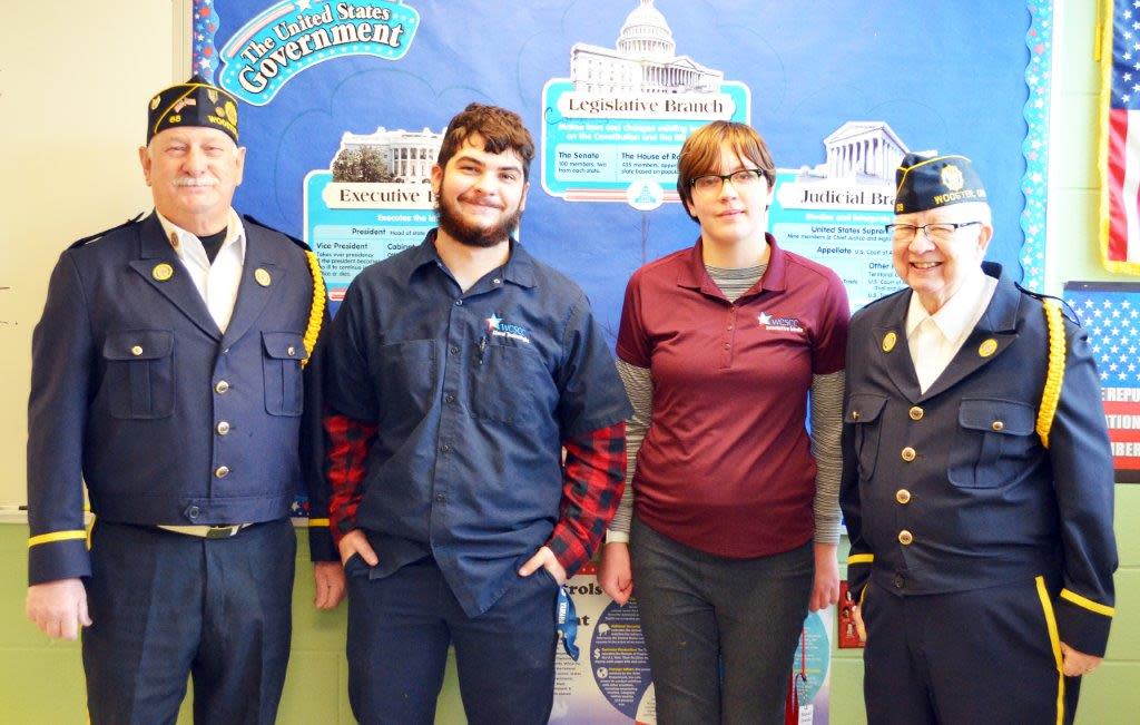 Wayne County Schools Career Center students Hunter Kerestes of Orrville, and Raquel Dewald of Wooster receive awards from Shirl Evans (left), commander of American Legion Post 68, and Otis Mekoleske, adjunct, for having the highest scores at the Career Center on the American Legion Americanism test.