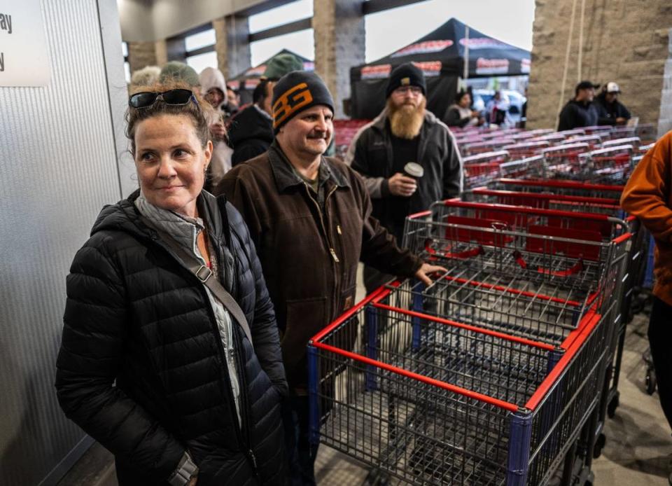 Elena and husband Dave Murray wait second and third in line for the Natomas Costco grand opening on Thursday, March 14, 2024. The couple spent the night in front of the store.