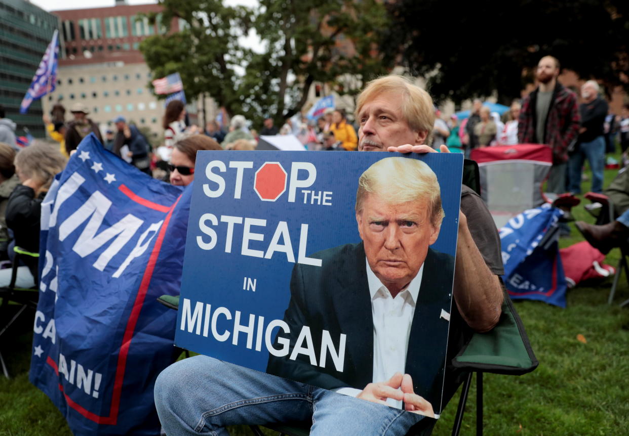 Supporters of former U.S. President Donald Trump gather outside the Michigan State Capitol to demand an audit of 2020 election votes, in Lansing, Michigan, U.S. October 12, 2021. (Rebecca Cook/Reuters)