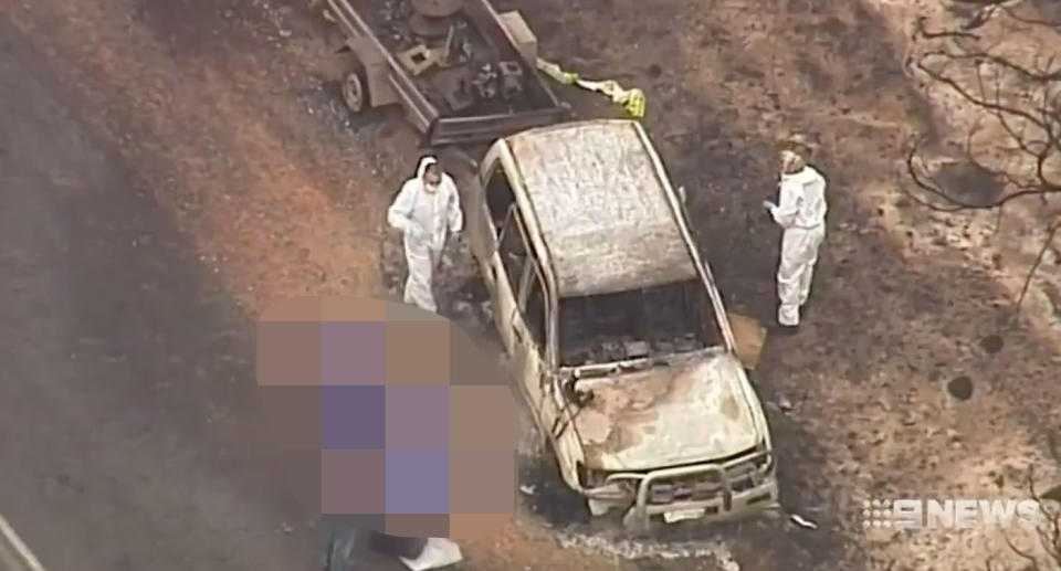 The Lang's burnt out vehicle at the side of the Playford Highway. Source: Nine News