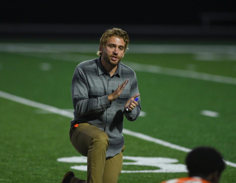 Tech boys soccer coach Dan Stoterau speaks with his players Tuesday, Sept. 1, 2020, at Tech High School.