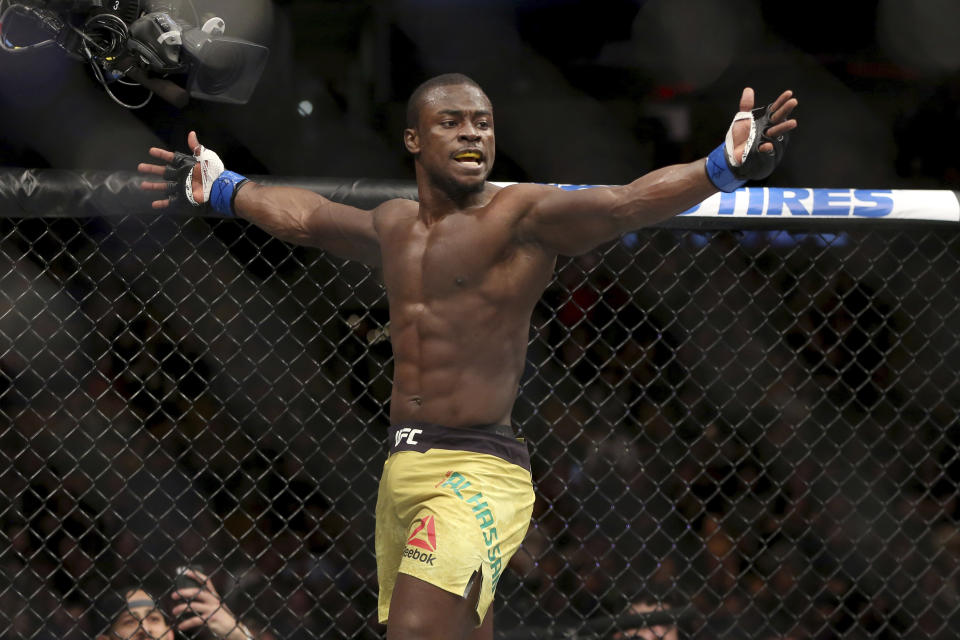 Abdul Razak Alhassan celebrates a knockout of Sabah Homasi after a mixed martial arts bout at UFC 220, Saturday, Jan. 20, 2018, in Boston. Alhassan won via 1st round knockout. (AP Photo/Gregory Payan)