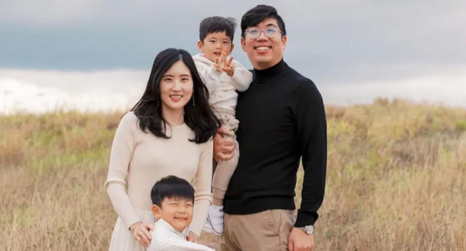 The family can be seen posing for a picture outdoors, with Kyu holding three-year-old James in his arm between him and his wife Cindy, with William standing in front of them. William's parents and brother were killed in the mass shooting.