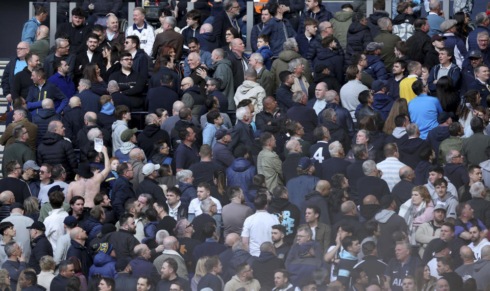 Fans turn their back on the game in the 65th minute in support of the "Save Our Seniors" group, who are protesting against removal of discounted season tickets for OAP's, during the English Premier League soccer match between Tottenham Hotspur and Luton Town at the Tottenham Hotspur Stadium, London, Saturday, March 30, 2024. (Steven Paston/PA via AP)