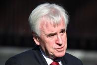 Britain's Labour Party's shadow chancellor John McDonnell talks with a journalist outside Westminster as parliament discusses Brexit, sitting on a Saturday for the first time since the 1982 Falklands War, in London