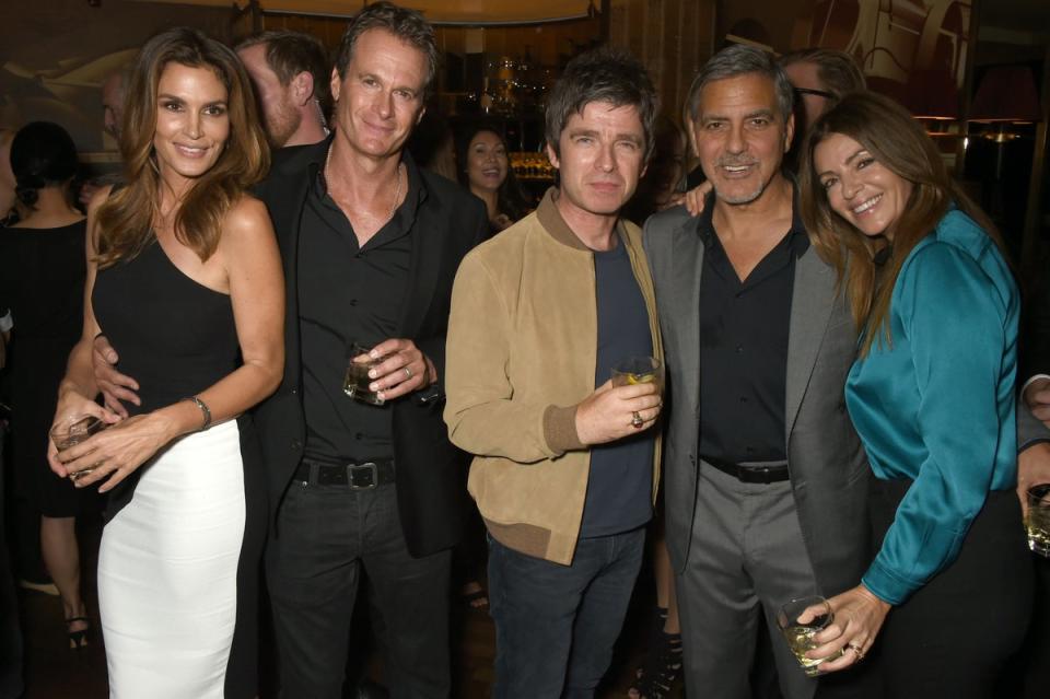 Noel Gallagher with his ex-wife Sara MacDonald (far right) in 2015, with George Clooney, Rande Gerber and Cindy Crawford (Dave Benett/Getty)