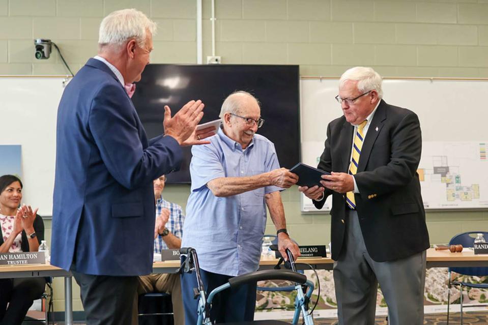 <p>Kayla Miller, Portage Public Schools</p> Robert Bonhomme receiving his high school diploma.