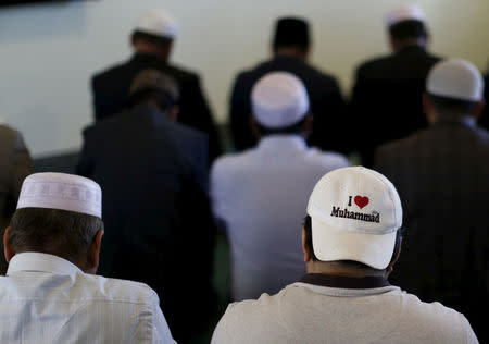 FILE PHOTO - People pray at the Ahmadiyya Muslim Community Baitus-Salaam Mosque during an open mosque event at which members of the public are invited to see how Ahmadiyya Muslims pray, in Hawthorne, California, U.S. on December 18, 2015. REUTERS/Mario Anzuoni/File Photo