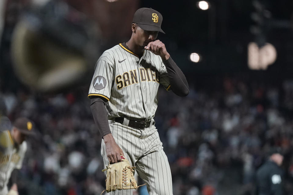 San Diego Padres pitcher Ray Kerr walks off the field after allowing a three-run home run to San Francisco Giants' Mike Yastrzemski during the 10th inning of a baseball game in San Francisco, Monday, June 19, 2023. The Giants defeated the Padres 7-4 in 10 innings. (AP Photo/Jeff Chiu)