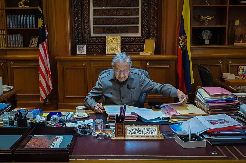 Interim prime minister Tun Dr Mahathir Mohamad gets down to business at Perdana Putra February 25, 2020. — Picture via Twitter