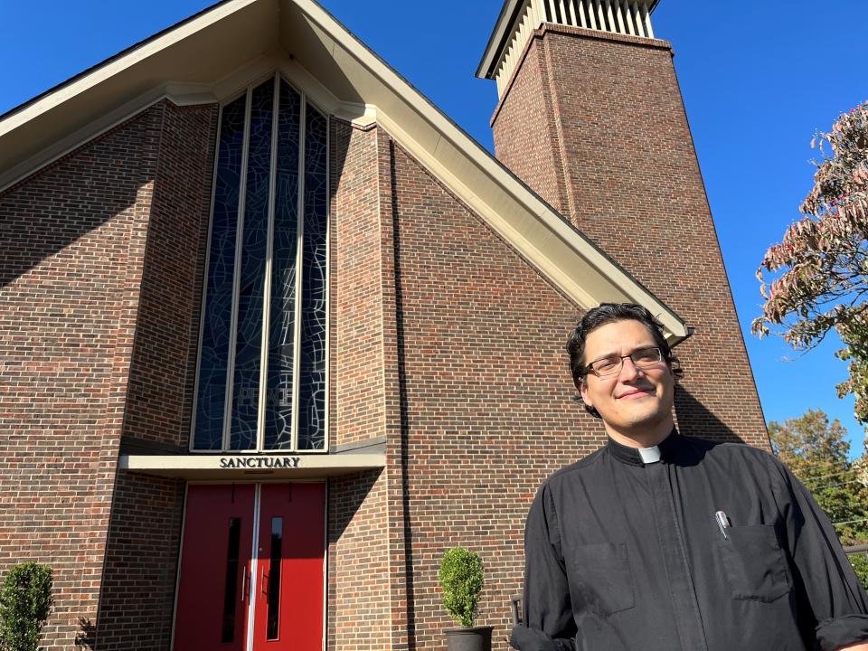 The Rev. Caleb Pitkin, the new pastor at First United Methodist Church on Kingston Pike, stands outside the church.