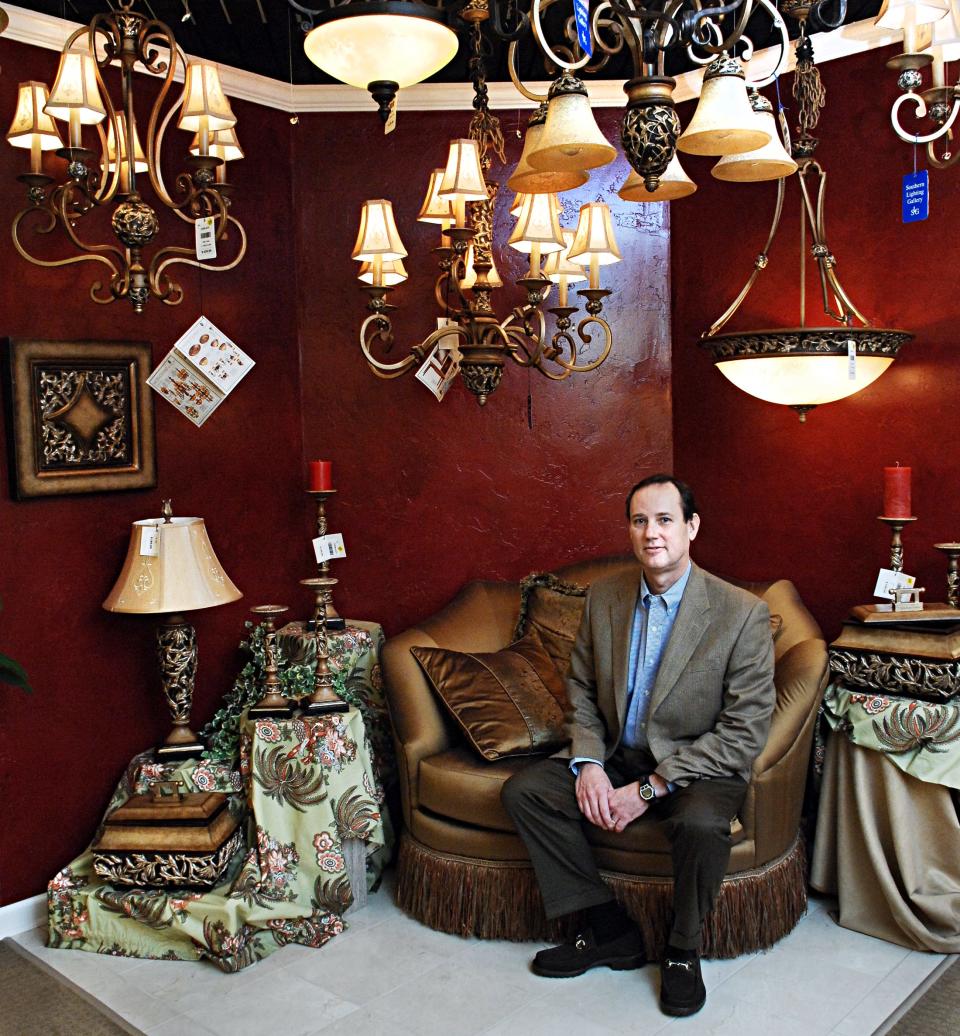 Brent Smith sits in a section of Southern Lighting Gallery's showroom in this 2010 photo. A Texas lighting manufacturer has acquired the 23-year-old Augusta business.