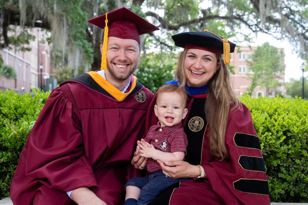 Josh and Rachel Duke spend time with their son, Arthur, on the Florida State University campus on Tuesday, April 30, 2024. The couple is ending their time at FSU with two degrees, a dissertation and a baby after a challenging few years.