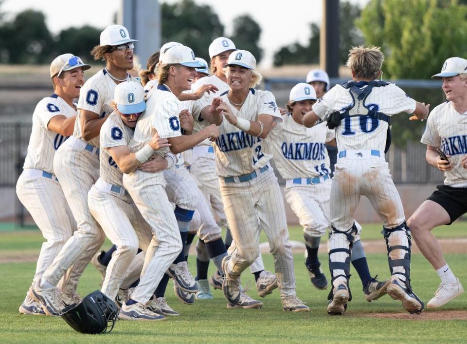 Oakmont players celebrate winning the Sac-Joaquin Section DIII championship game over Central Catholic at Islanders Park in Lathrop, Calif., Thursday, May 23, 2024. Oakmont won the game 3-0.