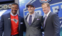 Eastern Illinois quarterback Jimmy Garoppolo poses for photos with NFL commissioner Roger Goodell and former New England Patriots linebacker Willie McGinest after being selected as the 62nd pick by the New England Patriots in the second round of the 2014 NFL Draft, Friday, May 9, 2014, in New York. (AP Photo/Jason DeCrow)