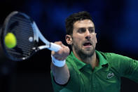 Serbia's Novak Djokovic hits a forehand to Norway's Casper Ruud during their singles final tennis match of the ATP World Tour Finals at the Pala Alpitour, in Turin, Italy, Sunday, Nov. 20, 2022. (AP Photo/Antonio Calanni)