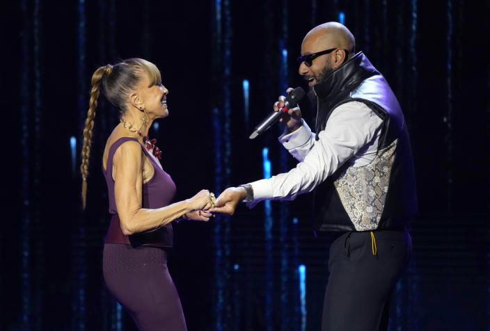 Swizz Beatz, right, presents the Recording Academy global impact award to Epic Records CEO Sylvia Rhone at the Black Music Collective on Thursday, Feb. 2, 2023, at The Hollywood Palladium in Los Angeles. (AP Photo/Chris Pizzello)