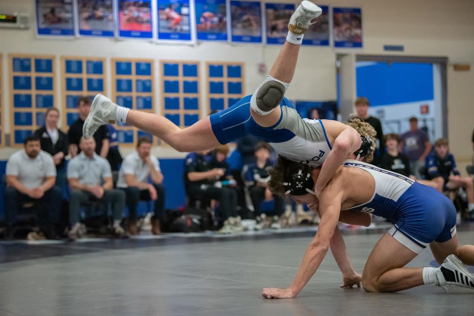 Poudre wrestler Billy Greenwood battles Fort Collins' Jude Miller during a city rivalry wrestling dual on Thursday, January 18, 2024 at Poudre High School in Fort Collins, Colo. The Impalas won 53-17.