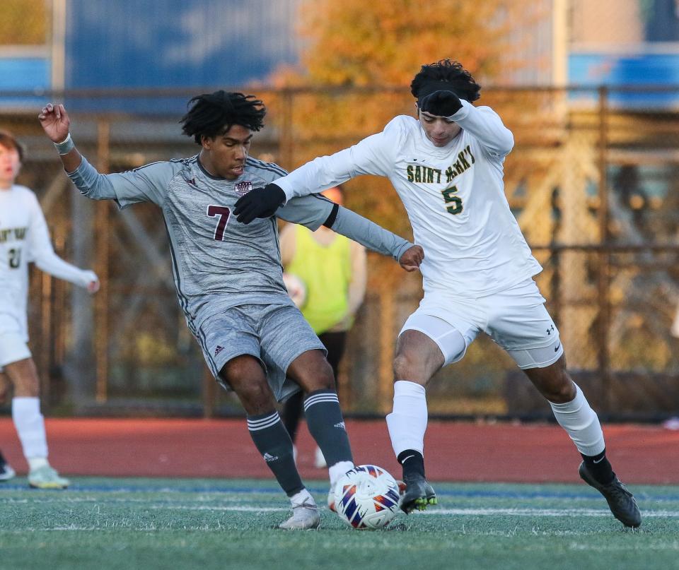 Caravel’s Miles Hood and Saint Mark’s Nicholas Rocco fight for position during the Buccaneers’ 4-0 win over Saint Mark's in the DIAA Division II Boys Soccer championship game Saturday, November 19, 2022 at Dover High School.