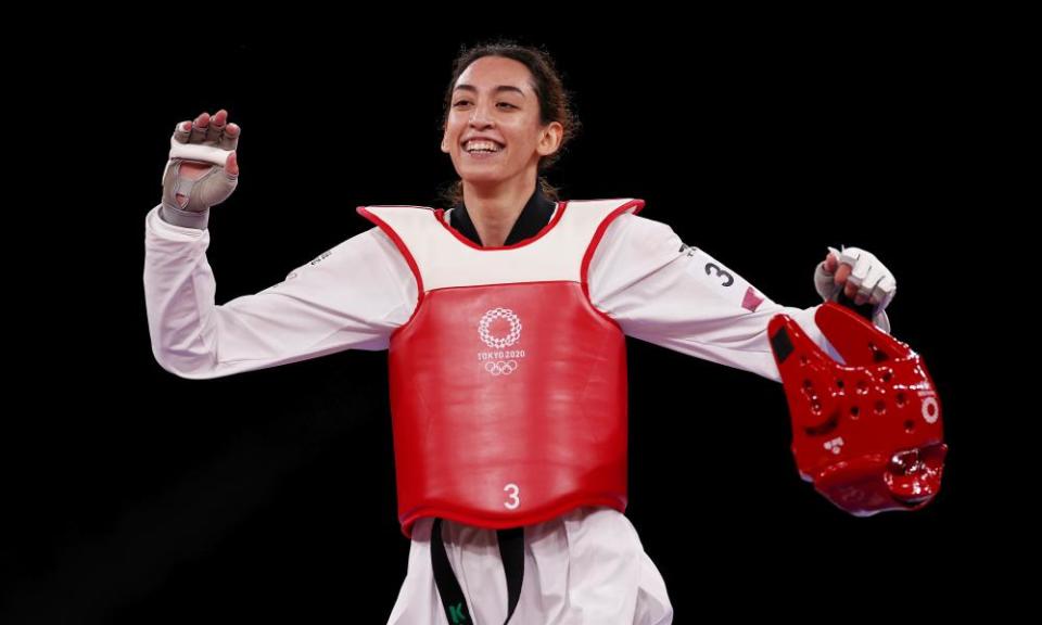 Kimia Alizadeh Zonouzi of IOC Refugee Team celebrates.