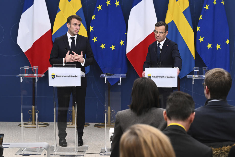 French President Emmanuel Macron, left, and Sweden's Prime Minister Ulf Kristersson hold a press conference in Stockholm, Sweden, Tuesday Jan. 30, 2024. France’s President Emmanuel Macron started a two-day state visit in Stockholm during which he will meet Swedish prime minister, Ulf Kristersson, and the country’s monarch, King Carl XVI Gustaf. (Claudio Bresciani/TT via AP)