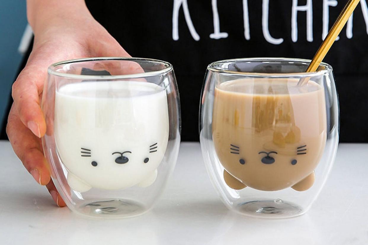 clear cat mugs holding with milk and coffee