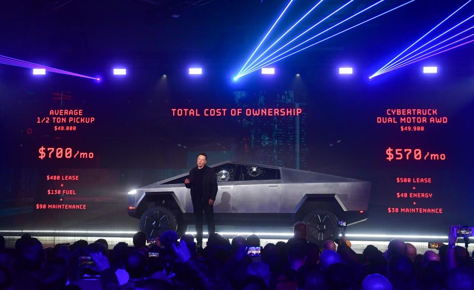 Tesla co-founder and CEO Elon Musk speaks in front of the newly unveiled all-electric battery-powered Tesla's Cybertruck with shattered windows, after a failed resistance test, at Tesla Design Center in Hawthorne, California on November 21, 2019. (Photo by FREDERIC J. BROWN / AFP) (Photo by FREDERIC J. BROWN/AFP via Getty Images)