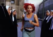 <p>On its surface, the German film <em>Run Lola Run</em> is about a blazingly red-headed woman running through the streets of Berlin in an attempt to save her boyfriend’s life. However, the twist is that once Lola reaches a dead-end (sometimes literally) in one of her runs, the film starts over from the beginning and Lola runs through Berlin once again, only this time small changes in her path create largely divergent outcomes by the film’s end. Although time is more of a thematic device than a strictly plot-driven one in Run Lola Run, its ruminations on time and the exploration of the <a href="https://www.americanscientist.org/article/understanding-the-butterfly-effect" rel="nofollow noopener" target="_blank" data-ylk="slk:Butterfly Effect;elm:context_link;itc:0" class="link ">Butterfly Effect</a>, the idea that small incidents can have lasting repercussions, makes <em>Run Lola Run</em> one of the most unique films on this list.</p>