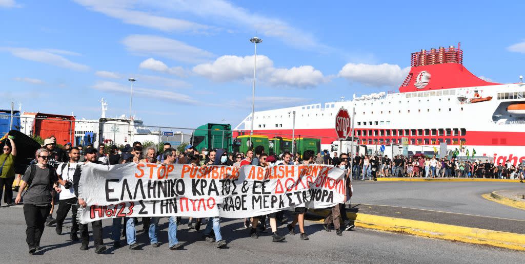 piraeus, greece june 18 protesters hold a banner during a demonstration following a deadly migrant shipwreck in piraeus, greece on june 18, 2023 photo by dimitris lampropoulosanadolu agency via getty images