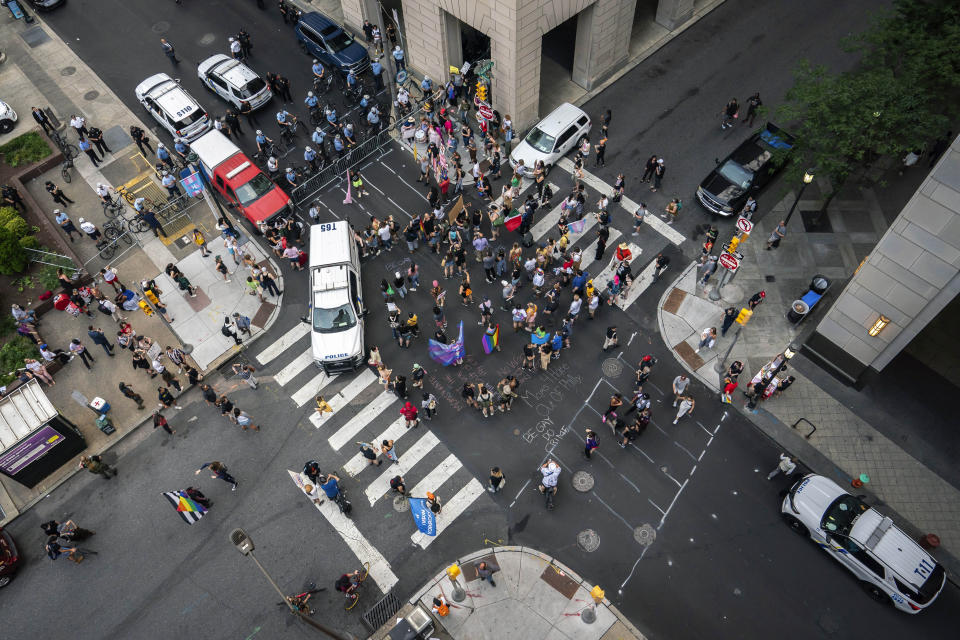 Demonstrators gather outside the Moms for Liberty meeting in Philadelphia, Friday, June 30, 2023. (AP Photo/Nathan Howard)