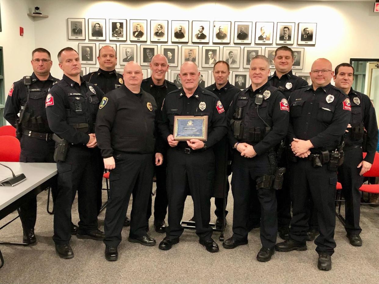 Pictured are (front row, from left) Lt. Mike Parker, City of Alpena Police Chief Joel Jett, City of Petoskey Department of Public Safety Director Matt Breed, Lt. Adrian Karr, Lt. Todd Troxel, (back row, from left) public safety officer Matt Mikulski, Mackinaw City Police Chief Todd Woods, City of Harbor Springs Police Chief Kyle Knight, public safety officer John Duch, public safety officer Erik Hoig and Lt. David Schultz at Monday's Petoskey City Council meeting.