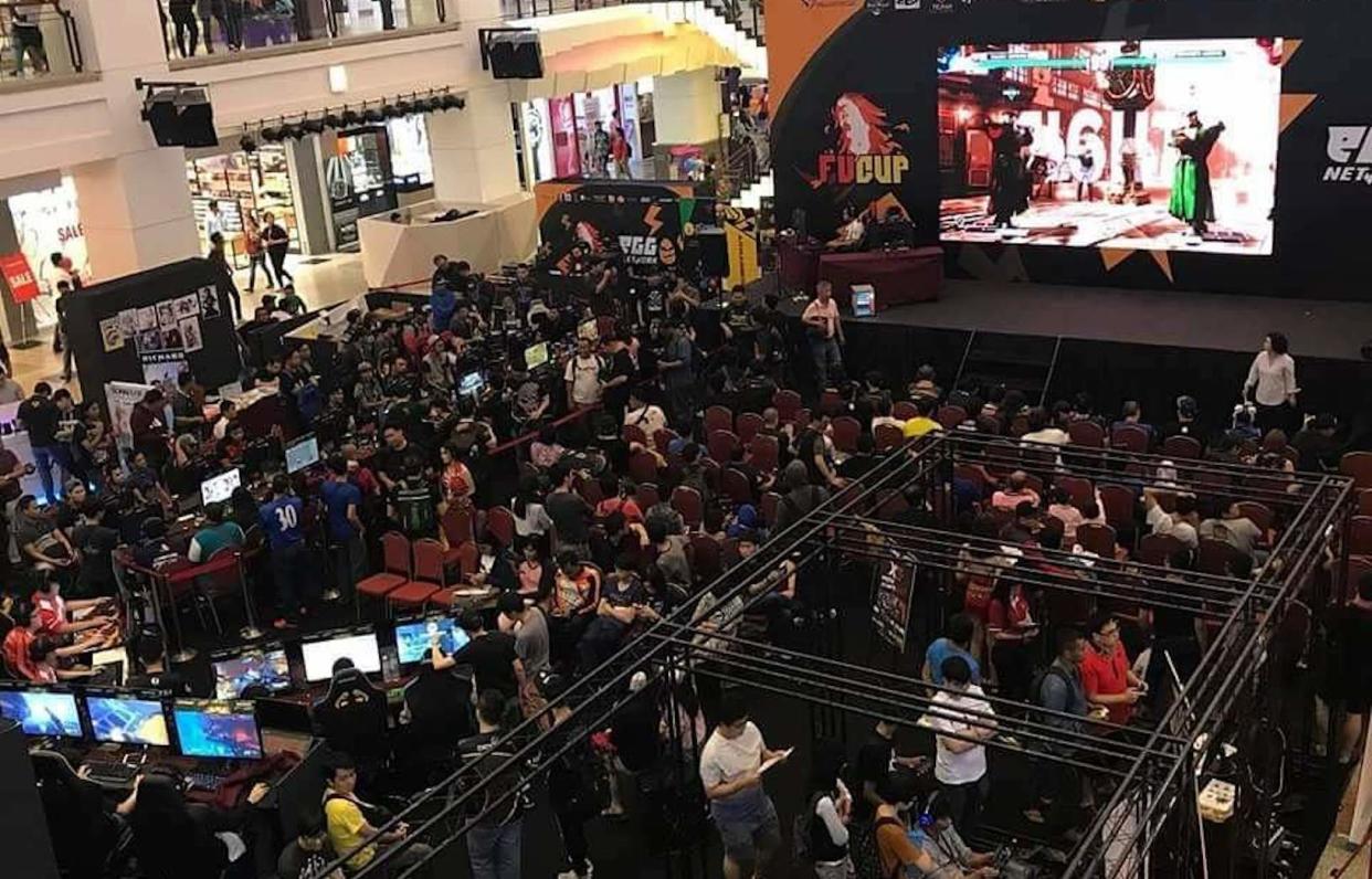 An esports event in Berjaya Times Square Malaysia, with a stage and large screen for hundreds of audiences.