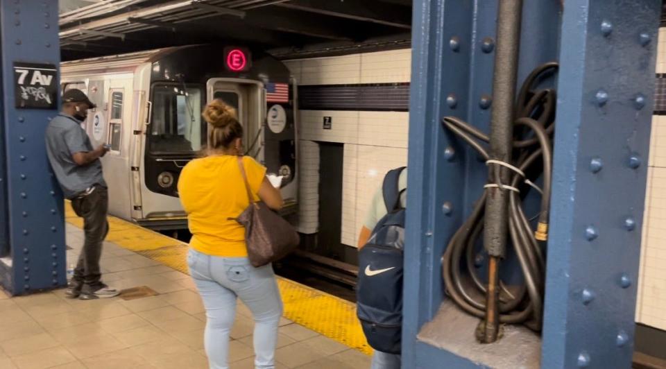 Waiting for the E train on a steamy New York summer afternoon.