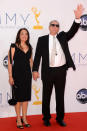 Ed O'Neill and guest arrive at the 64th Primetime Emmy Awards at the Nokia Theatre in Los Angeles on September 23, 2012.