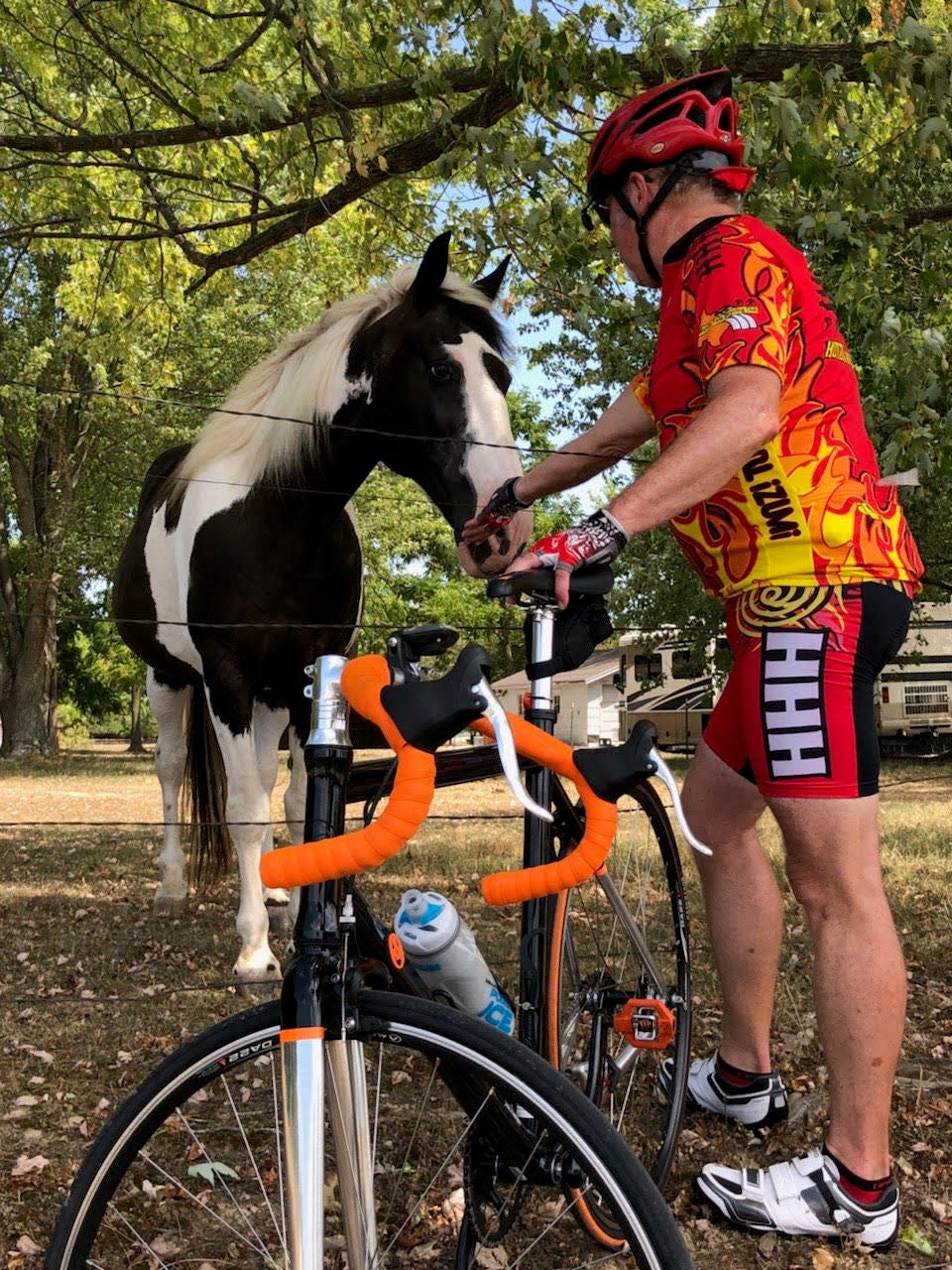 Chris Webster, a cyclist from Ozark, pets a horse during a stop along a previous Big BAM (Bicycle Across Missouri) tour. Webster, originally from Kansas, began cycling in high school. Over the years, he has participated in several 100-plus mile bike tours, including Big BAM. The six-day bike ride starts in Joplin on June 13. Cyclists will travel through Willard, Lebanon, Waynesville, Rolla, Cuba, and end in Eureka June 18.