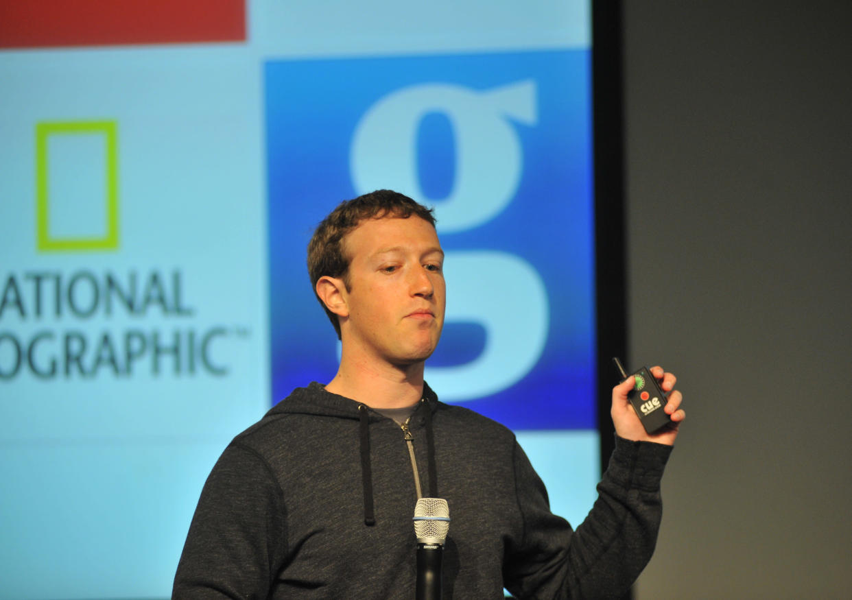 Facebook CEO Mark Zuckerberg controls a slide show as he speaks during a media event at Facebook's Headquarters office in Menlo Park, California on March 7, 2013. Today, Facebook announced updates to their News Feed. AFP PHOTO /Josh EDELSON        (Photo credit should read Josh Edelson/AFP/Getty Images) (Photo: )