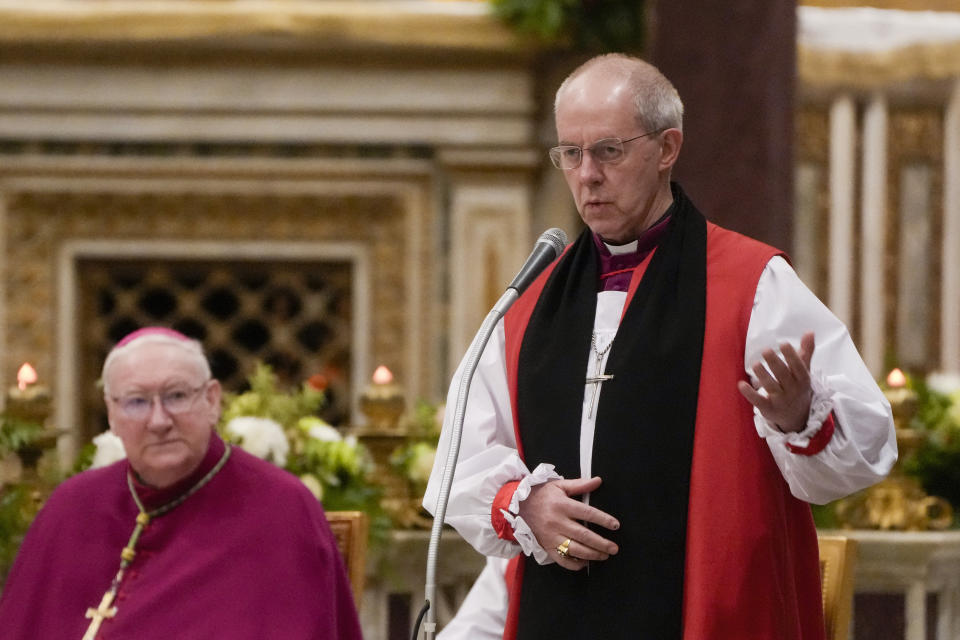 FILE - Archbishop of Canterbury Justin Welby delivers his speech as Pope Francis presides over the first vespers on the day the Catholic church celebrates the conversion of St. Paul, in the St.Paul's Basilica, in Rome, on Jan. 25, 2024. An advisory panel says the Church of England should create a fund of 1 billion pounds ($1.27 billion) to address its historic links to slavery. That's 10 times the amount the church has already set aside. (AP Photo/Gregorio Borgia, File)