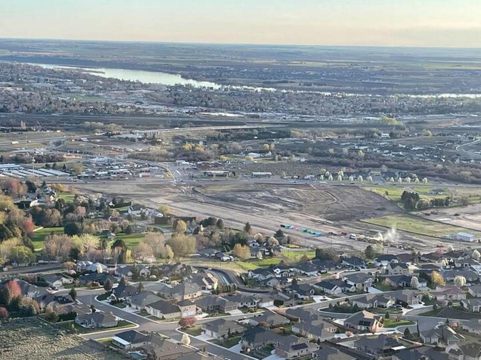 Earth moving equipment prepares the hillside above Queensgate Boulevard and Keene Road in south Richland for Terraces at Queensgate.