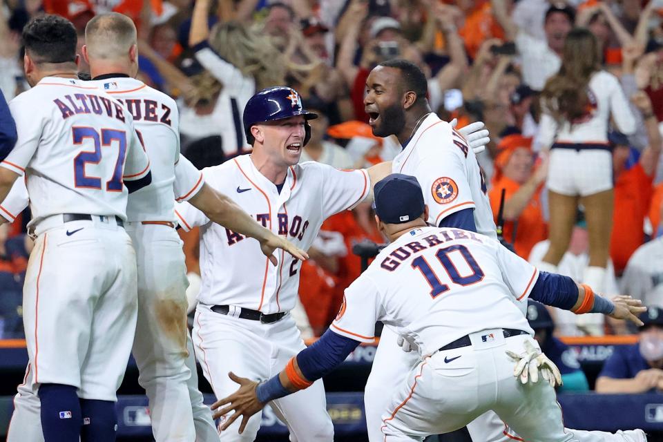 Astros' Yordan Alvarez celebrates after after hitting a walk-off three-run home run against the Mariners in the ninth inning.