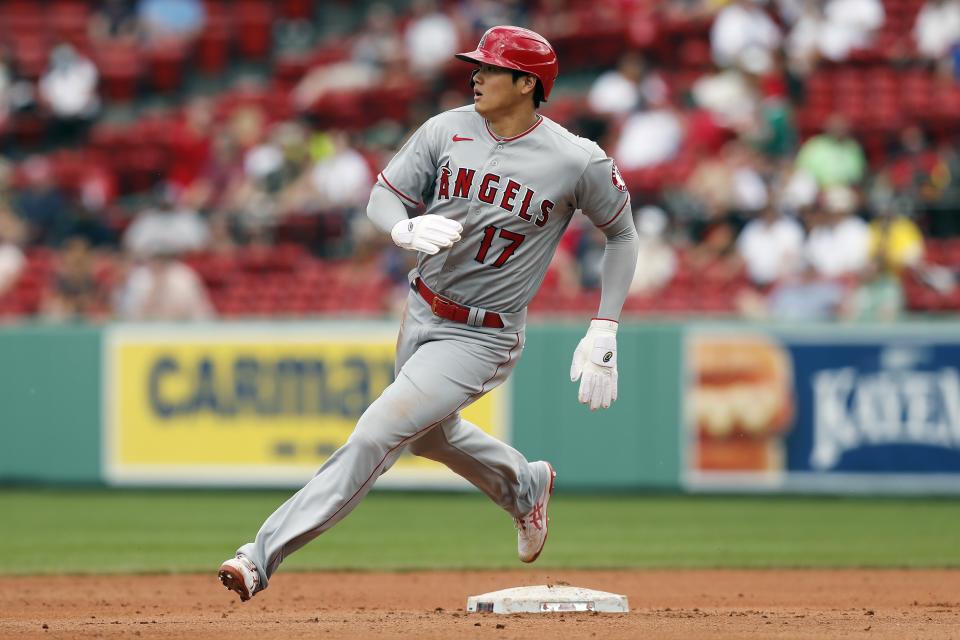 Los Angeles Angels' Shohei Ohtani rounds second base on a double by Jared Walsh during the fifth inning of a baseball game against the Boston Red Sox, Sunday, May 16, 2021, in Boston. (AP Photo/Michael Dwyer)