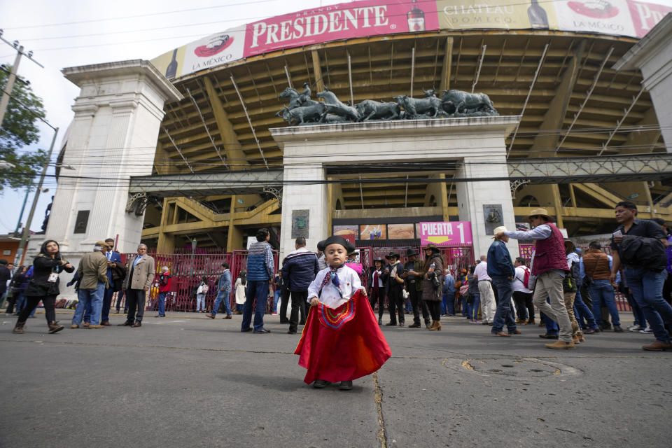 People arrive to the Plaza Mexico for a bullfighting in Mexico City, Sunday, Jan. 28, 2024. Bullfighting returns to Mexico City after the Supreme Court of Justice overturned a 2022 ban that prevented these events from taking place in the capital. (AP Photo/Fernando Llano)