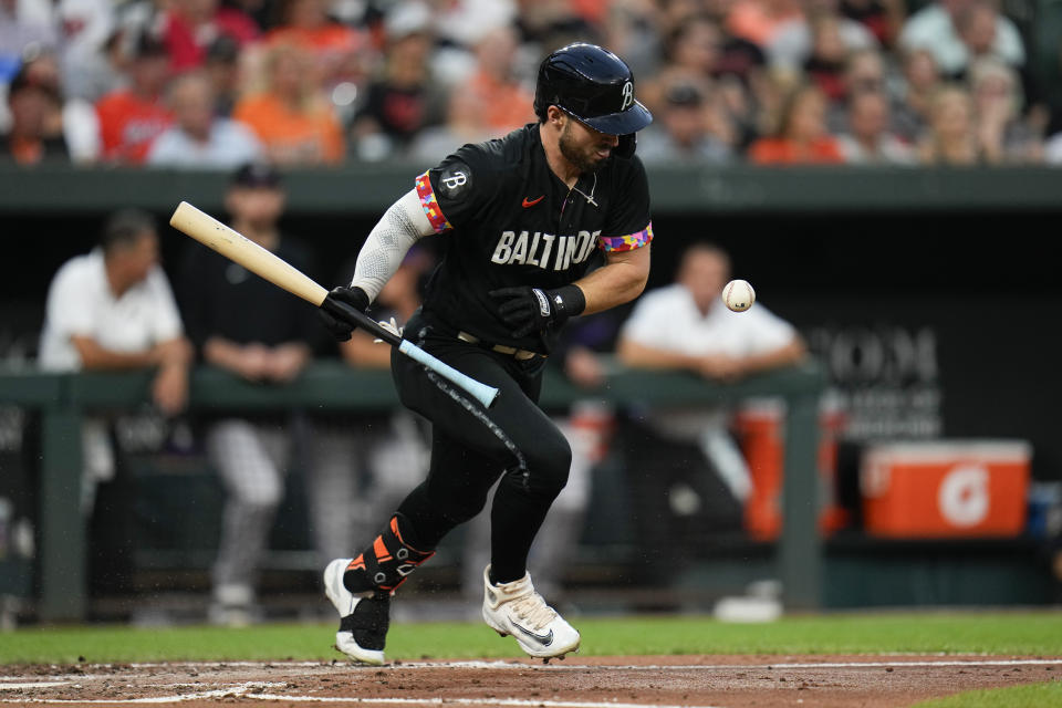 Baltimore Orioles' Ryan McKenna runs to first base on a sacrifice bunt during the second inning of a baseball game against the Colorado Rockies, Friday, Aug. 25, 2023, in Baltimore. (AP Photo/Julio Cortez)