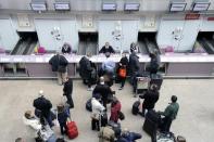 Passengers check in for a flight to Reykjavik, Iceland, at Scotland's Glasgow Airport in April 2010. Iceland hopes its certificate for those vaccinated against COVID-19 will reduce barriers to travel but other countries feel it's much too soon.