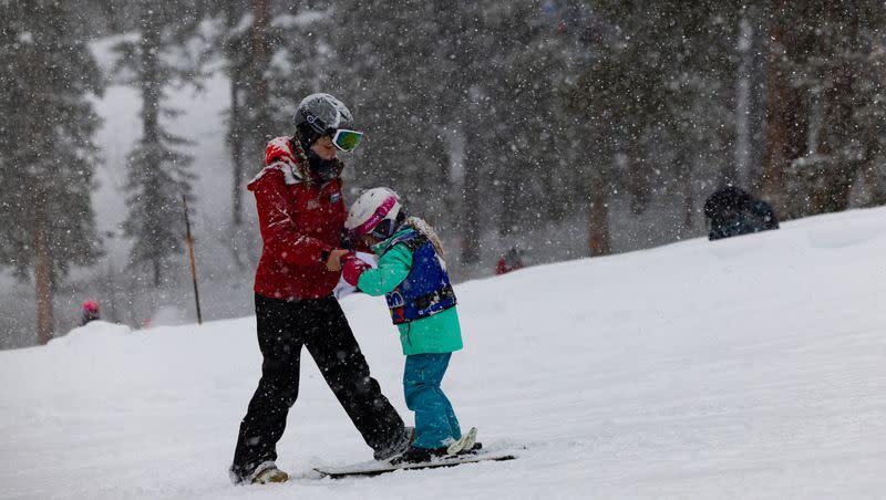 Peer instructor Sydney Tyler gives ski lessons to a child at Brighton Resort in Big Cottonwood Canyon on Saturday, Jan. 20, 2024.