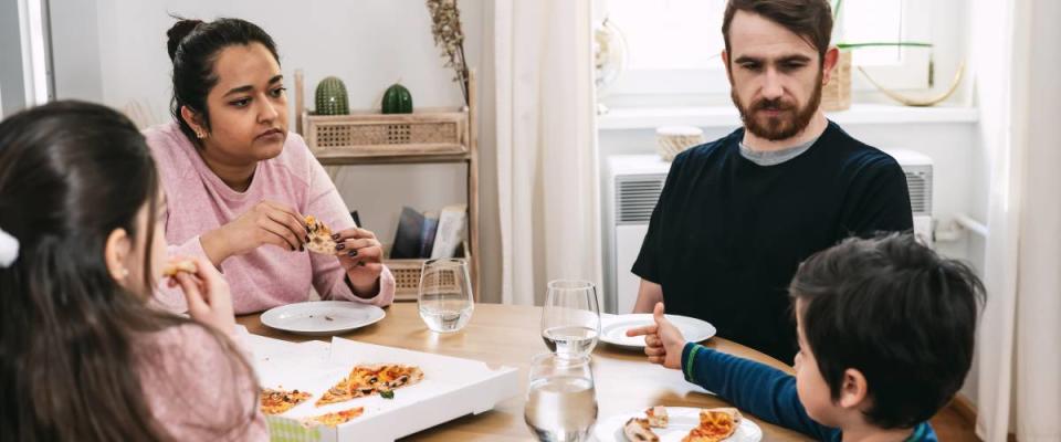 family eating pizza