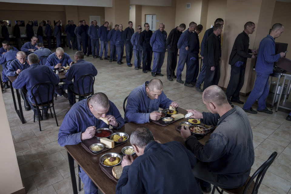 Russian prisoners of war eat lunch at a detention center in Ukraine's Lviv region, Thursday, April 25, 2024. AP visited the center as part of a small group of journalists on the condition that its exact location be withheld. (AP Photo/Evgeniy Maloletka)